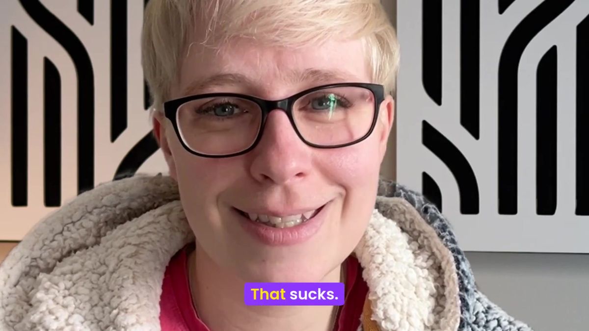 Jenny Lucas speaking to camera and smiling, captioned: That sucks.